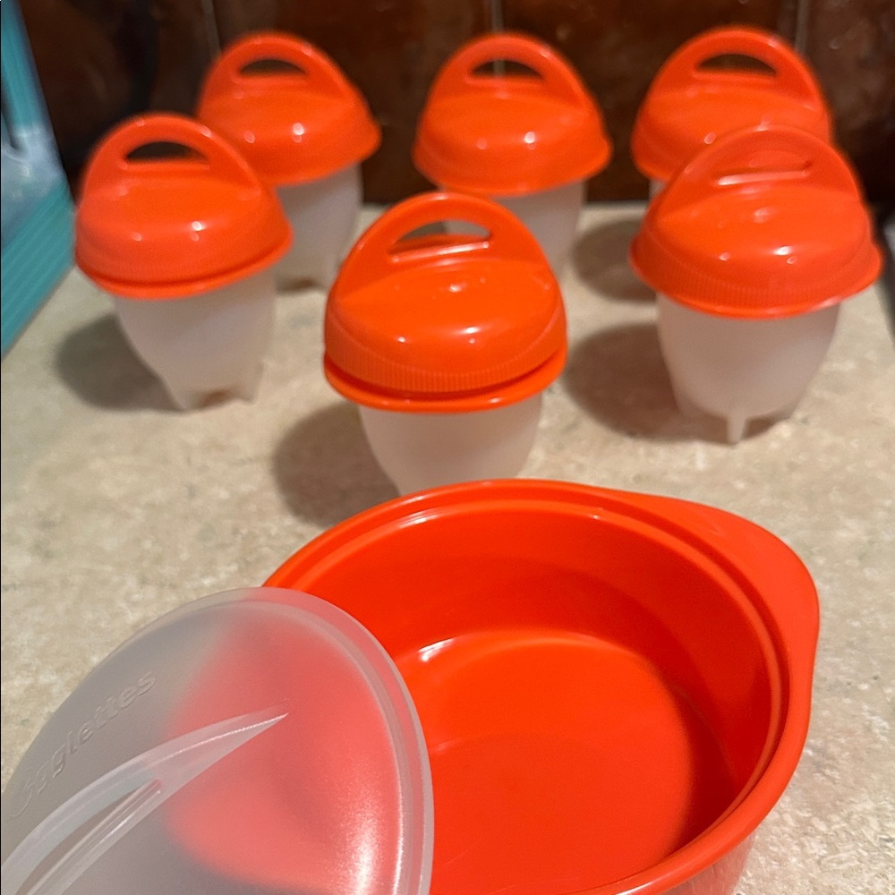 Set of Orange and White Egg Cookers
